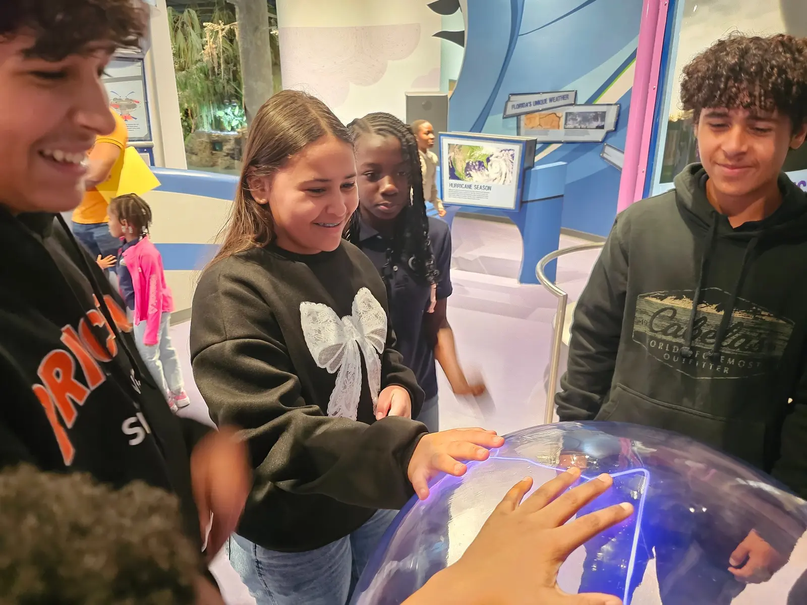 HCA students exploring a hands-on science exhibit